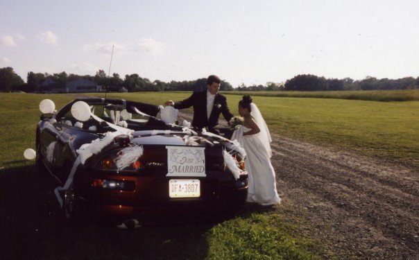 nontraditional bridal car red convertible