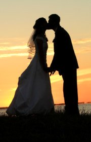 bride and groom silhouette in sunset