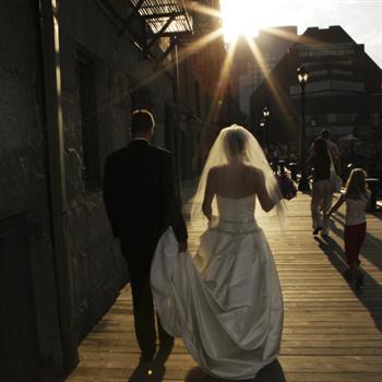outdoor wedding couple walking towards the sunset